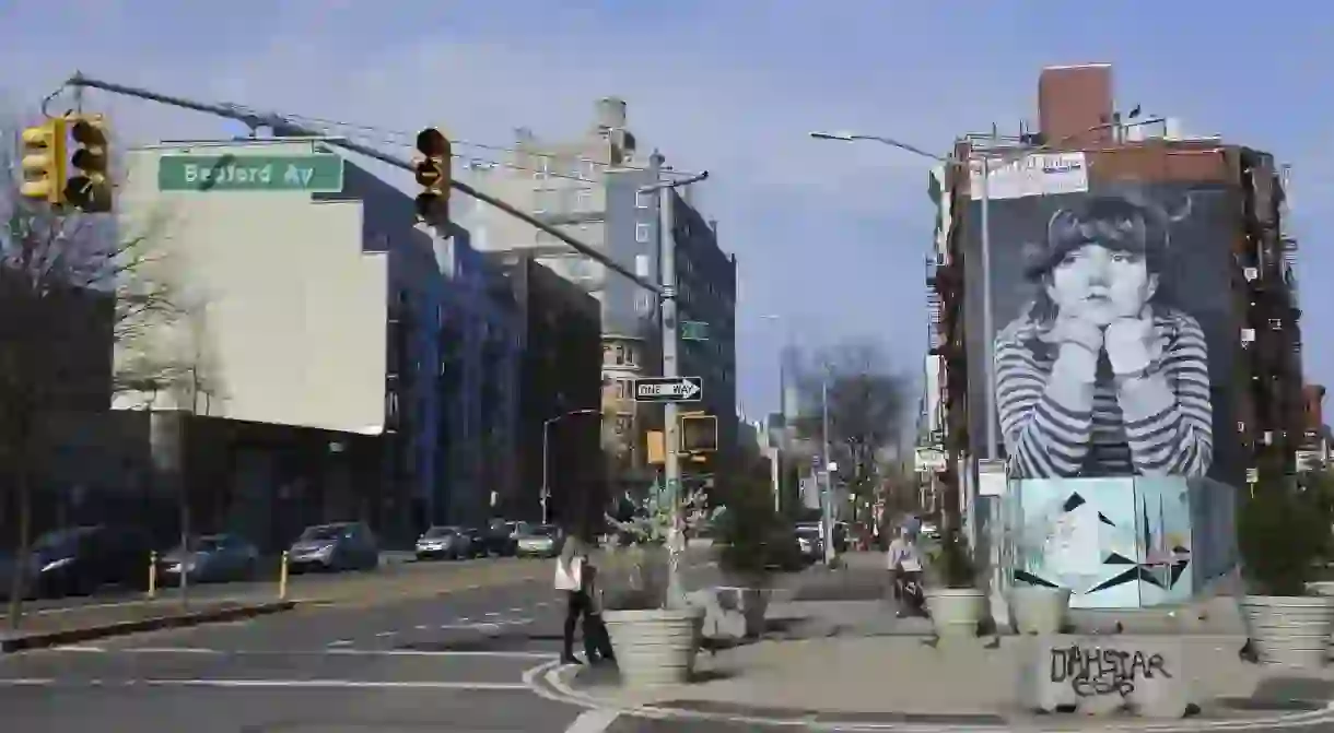 One World Trade Center looms on the horizon in this street scene from Williamsburg