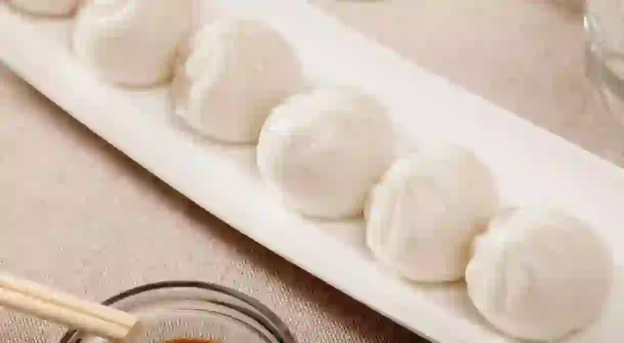 Dim sum dumplings served on white plate