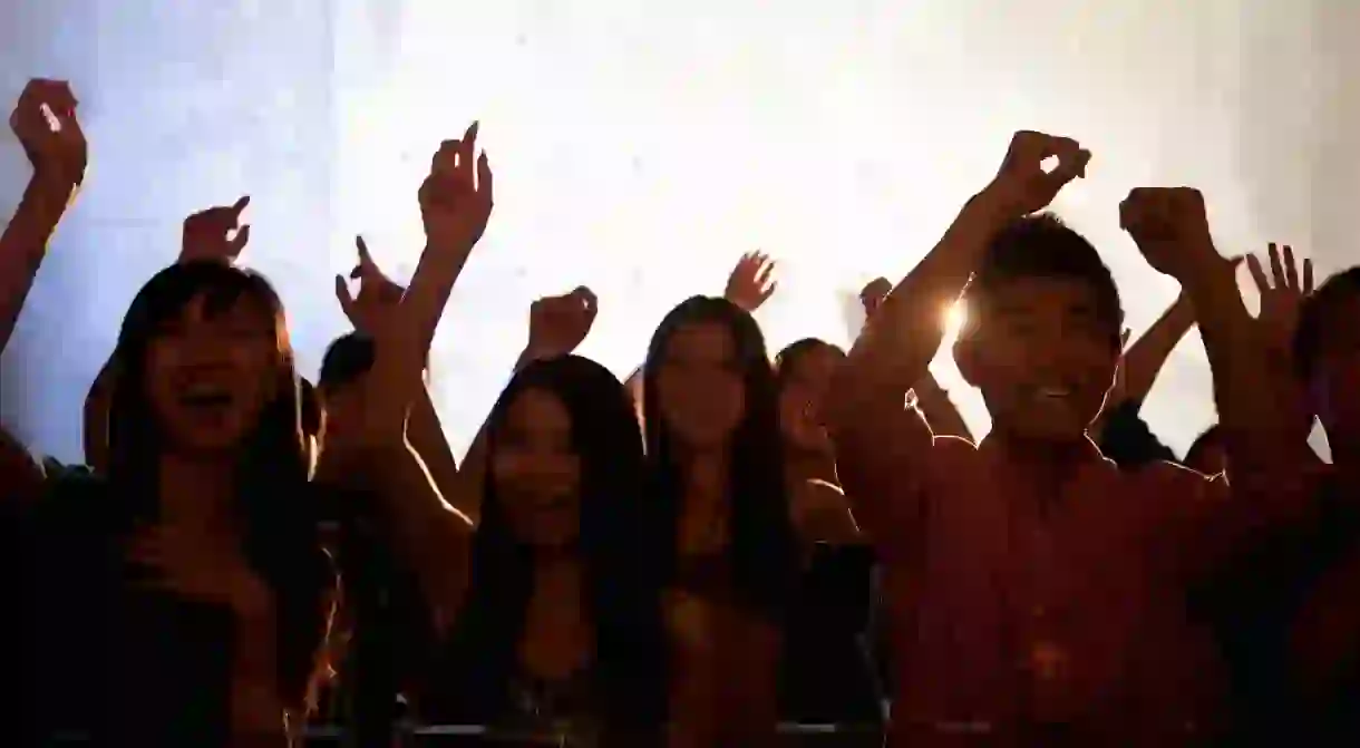 People dance in a nightclub in Beijing, China