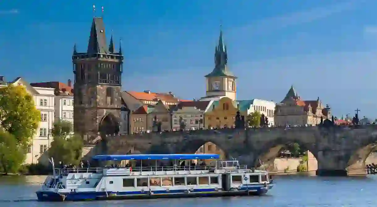 A boat stays afloat on the Vltava River in Prague