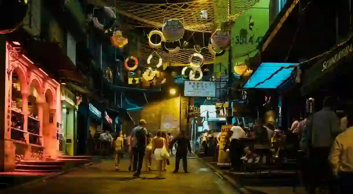 People enjoy happy hour in Lan Kwai Fong, Hong Kong