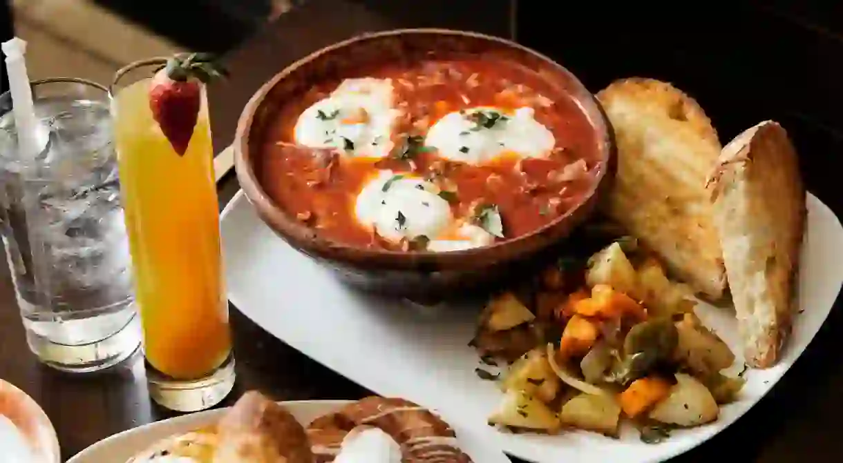 French pastries are paired with stewed tomatoes and eggs at Brunos Bakery