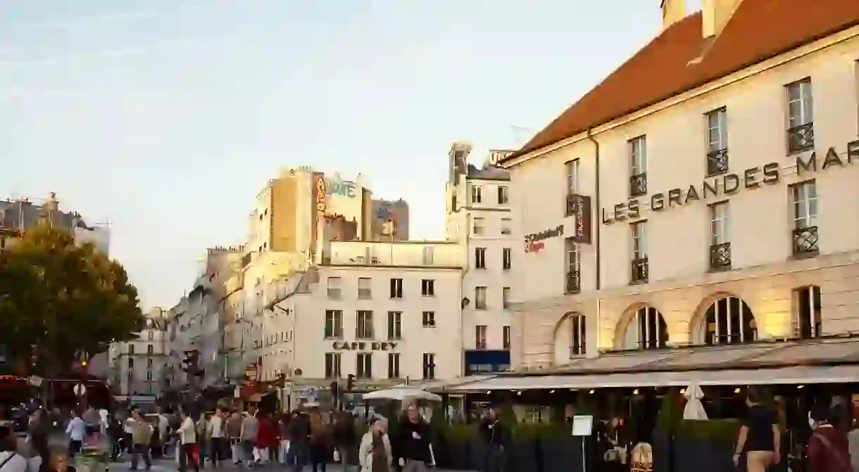 Crowds of people explore Bastille, Paris