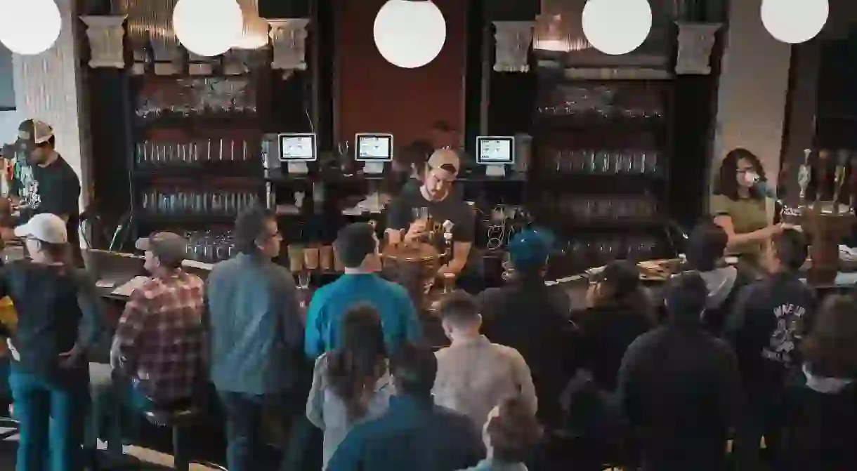 Customers lined up at a bar in Los Angeles, California.