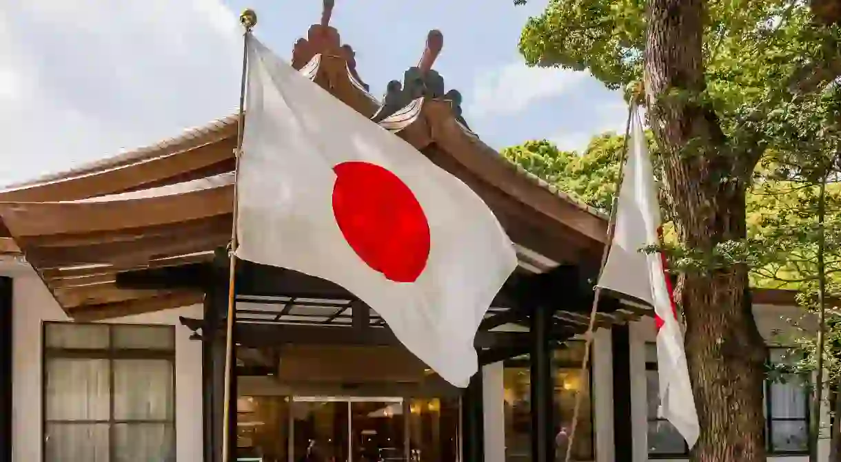 Flag of Japan waving in the Meiji shrine in Tokyo