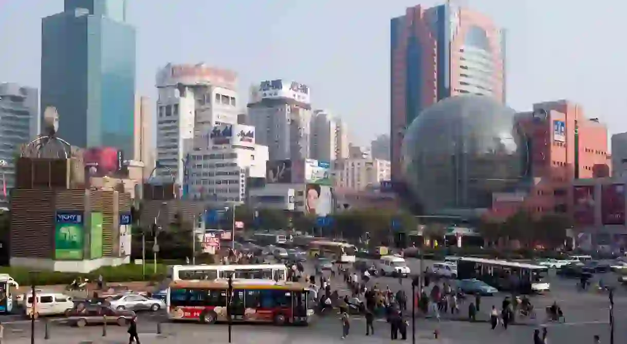 Crowds of people explore the Xujiahui shopping area in Shanghai, China