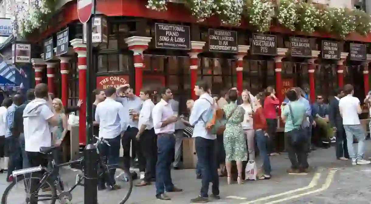 People drinking outside the Coach and Horses pub