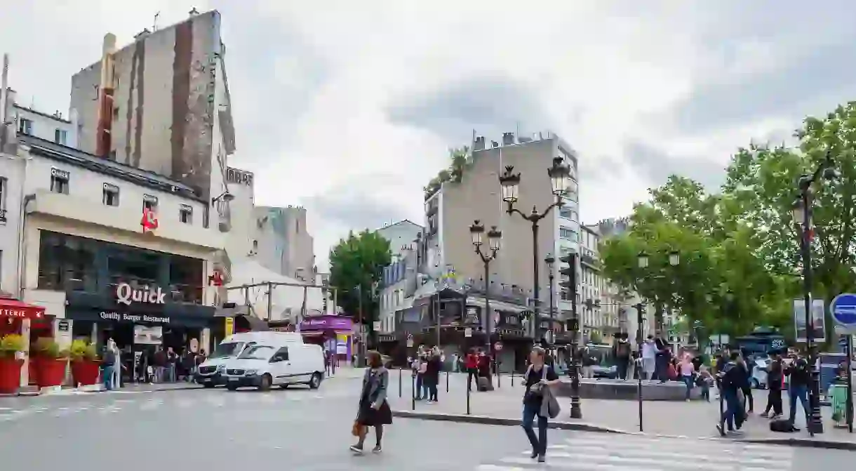 Pedestrians roam Pigalle trying to decide where to eat