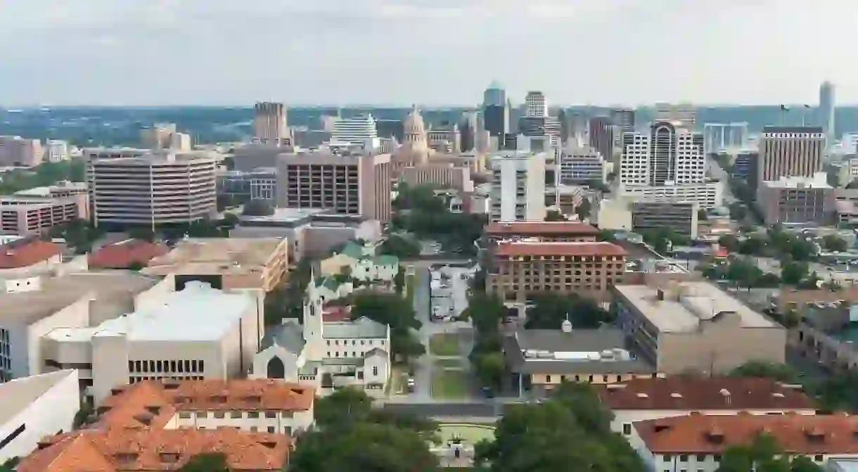 Aerial panorama of downtown Austin and Texas State Capitol from University of Texas Main Building Tower, Austin, Texas, USA.