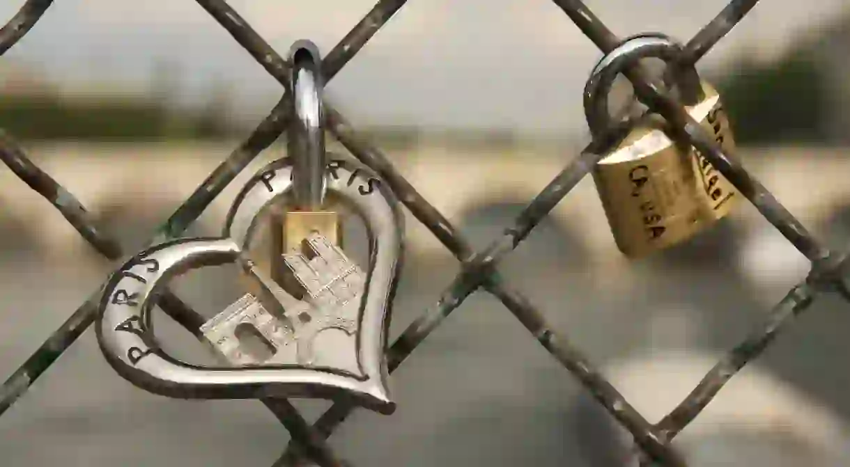 Padlocks of love are affixed to the Passerelle des Arts, Paris