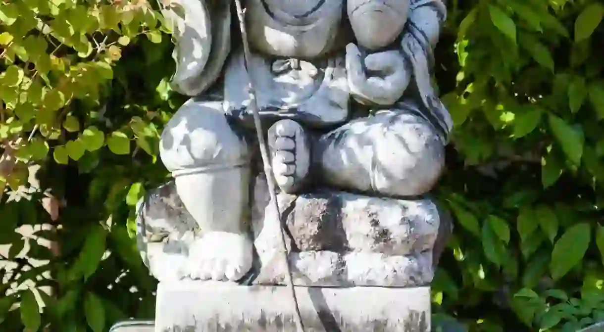 Statue of the Japanese God, Ebisu, aka Webisu, Hiruko god of fishermen and luck. One of the seven gods of good fortune.