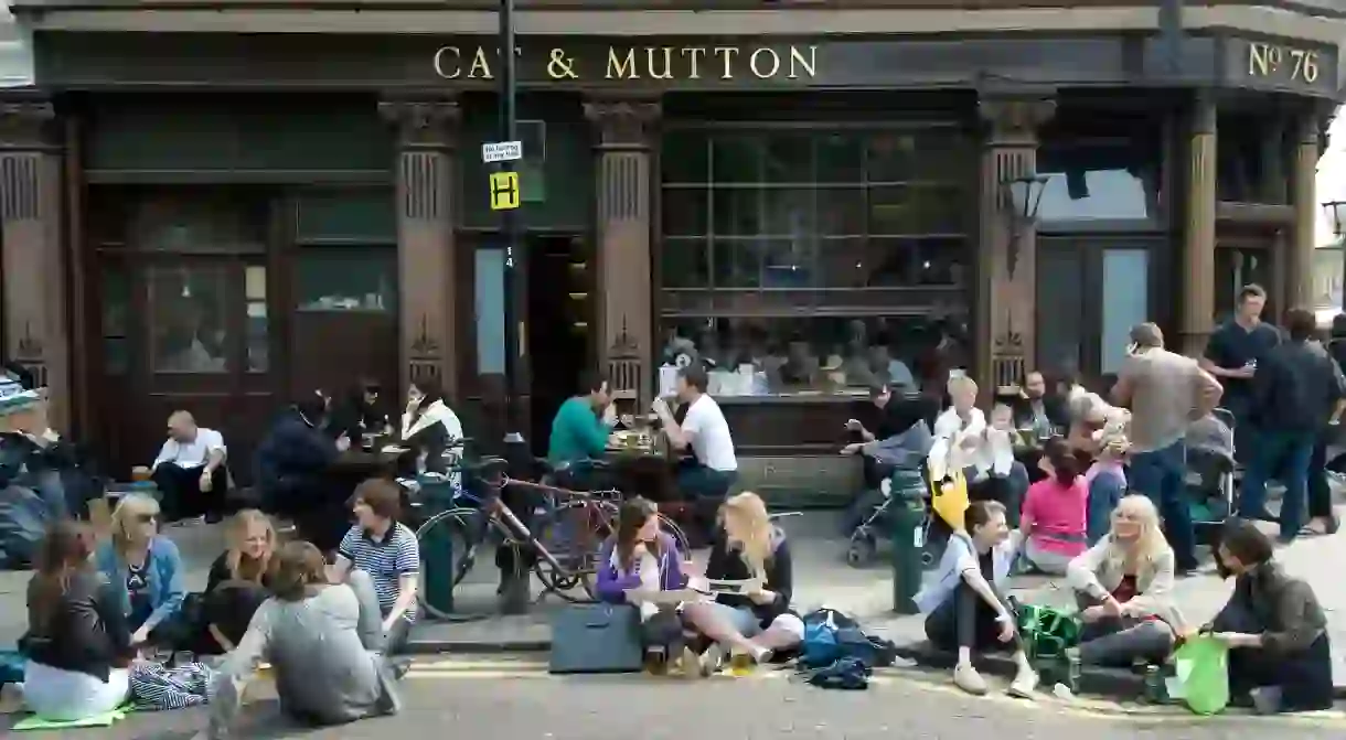 Drinkers in the sun outside the Cat and Mutton, Hackney