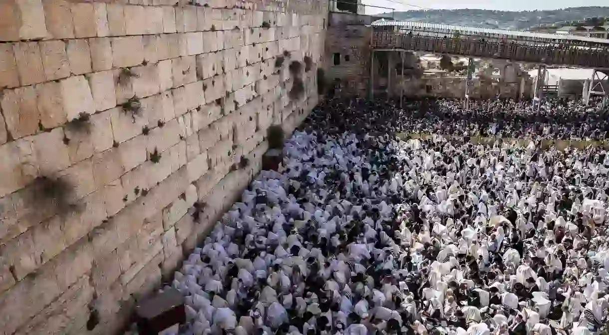 Mandatory Credit: Photo by Tsafrir Abayov/AP/REX/Shutterstock (9489175a) Ultra-Orthodox Jewish men of the Cohanim Priestly caste participate in a blessing during the Jewish holiday of Passover, at the Western Wall, the holiest site where Jews can pray in Jerusalems Old City, . The Cohanim, believed to be descendants of priests who served God in the Jewish Temple before it was destroyed, perform a blessing ceremony of the Jewish people three times a year during the festivals of Passover, Shavuot and Sukkot Israel Passover - 02 Apr 2018