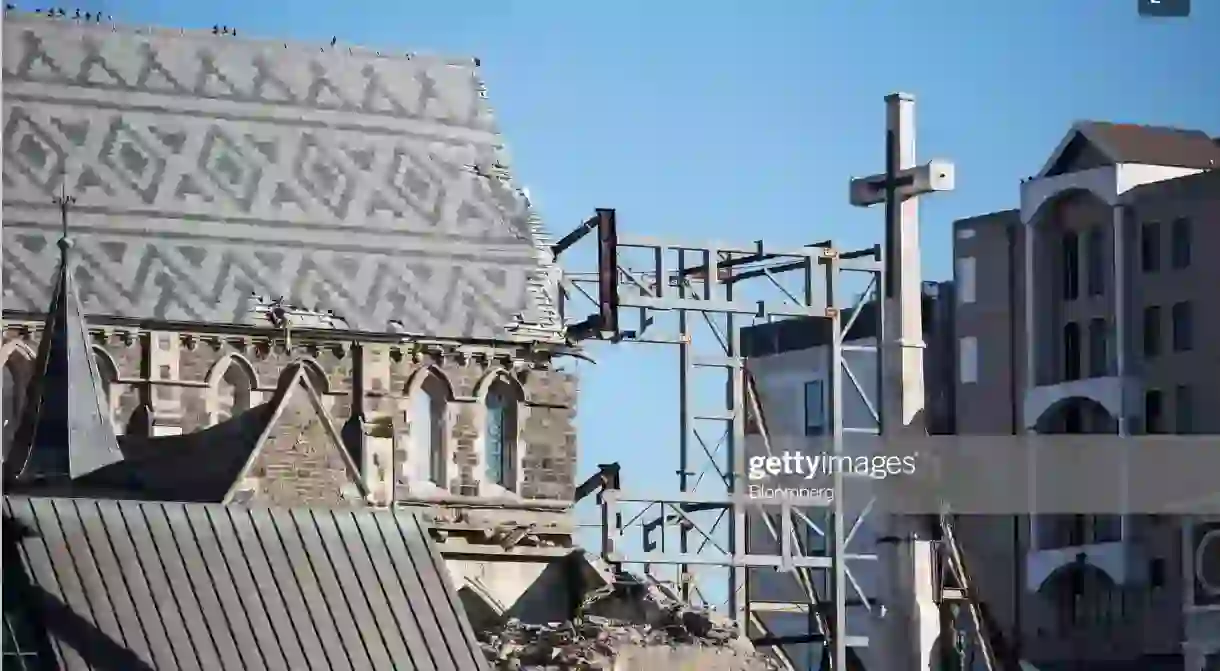 A cross stands next to the Christchurch Cathedral as it undergoes repairs in Christchurch, New Zealand.