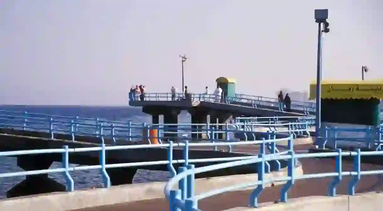 Tourists gaze out over the water in Jeddah