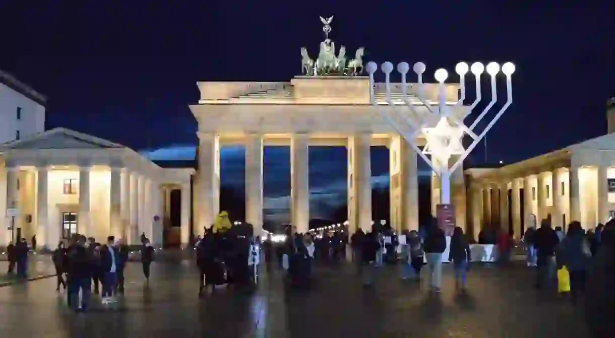 A Hanukkah menorah stands in front of Brandenburg Gate