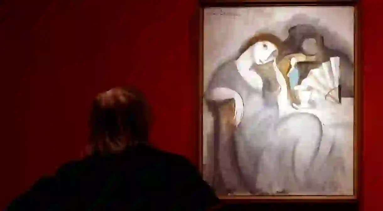 Mandatory Credit: Photo by Julian Martin/EPA/REX/Shutterstock (8037573a) A Woman Observes a Painting (l) by Marie Laurencin and a Work by Andr? Derain (r) From the Personal Collection of Spanish Artist Pablo Picasso Which Are Exhibited Together with Works by Renoir Cezanne Rousseau Braque and Matisse As Well As Primitive Pieces of Art Spain Barcelona Spain Painting - Dec 2007