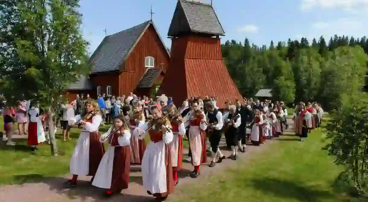 People celebrating midsummer festival, Evertsberg, Dalarna, Sweden