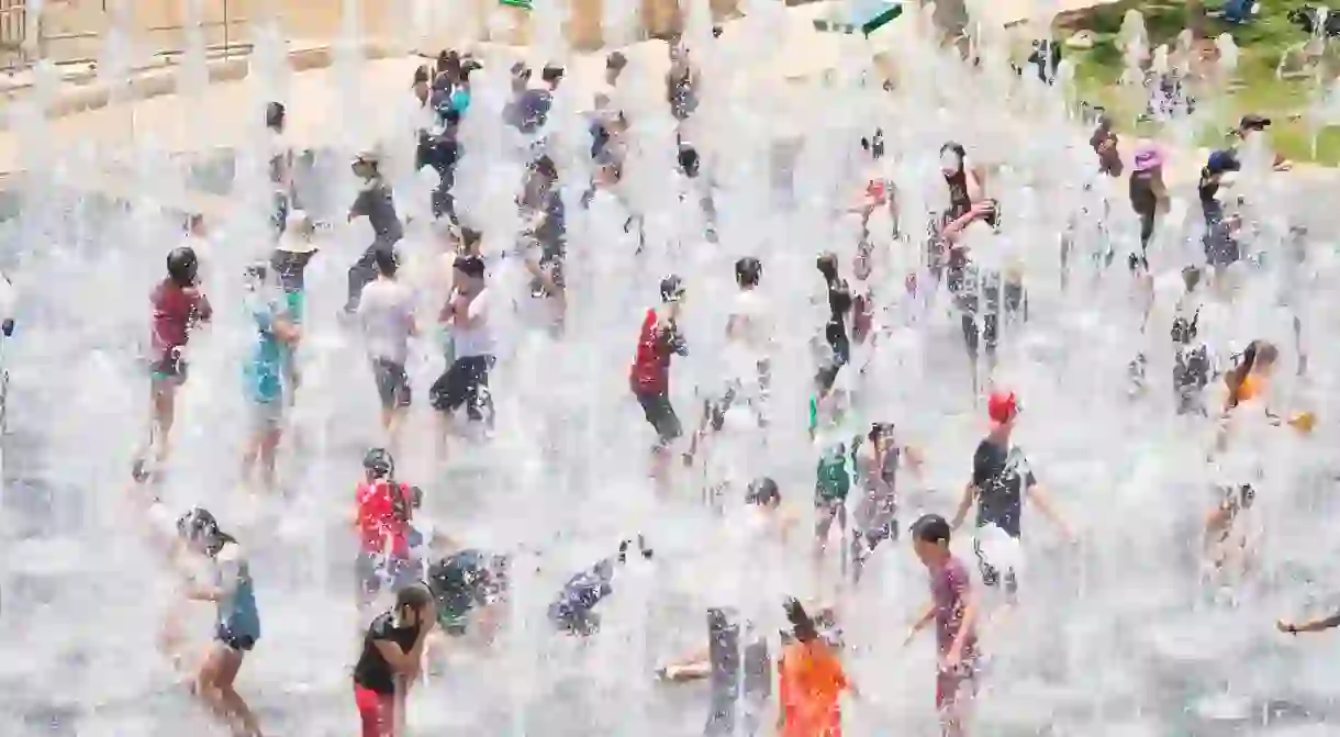 Children enjoy the Teddy Park water fountain in Jerusalem