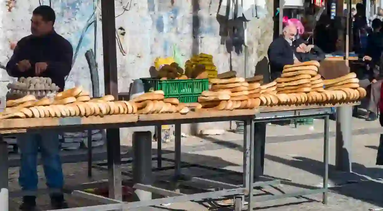 A street vendor sells food in a market in the Old City of Jerusalem