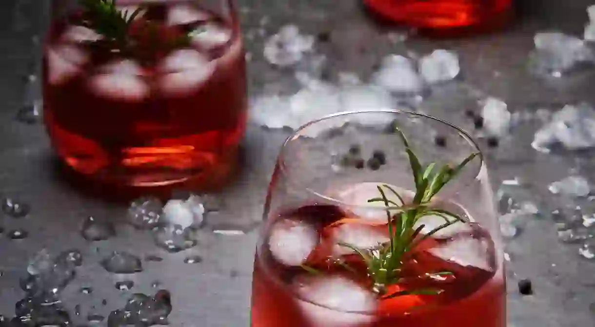 Pomegranate cocktail with ice and rosemary