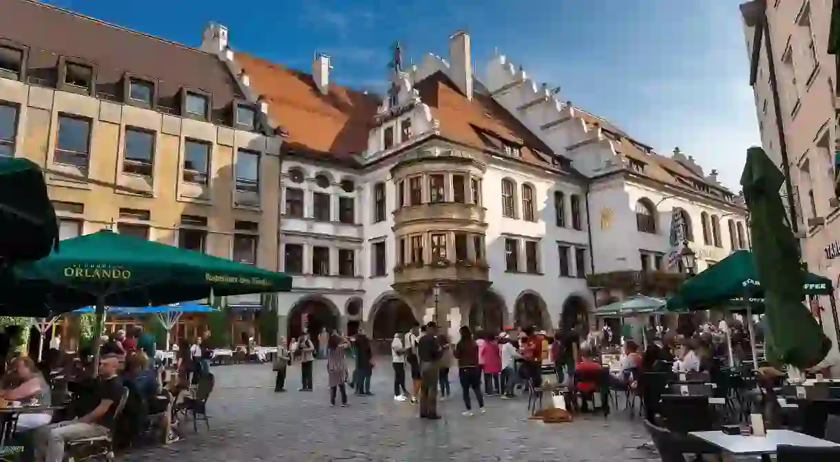 Enjoy a local brew at a beer hall in one of Munich’s many pretty squares