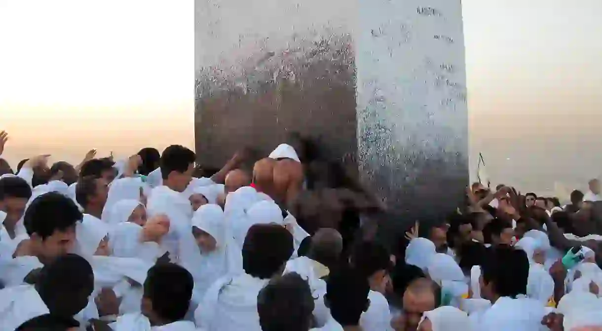 Pilgrims kiss the Black Stone during the annual hajj pilgrimage to Mecca