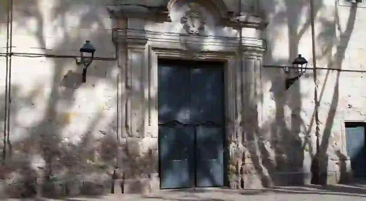 Walls of church in the Old City pockmarked with bullet holes from the Spanish Civil War, Barcelona.