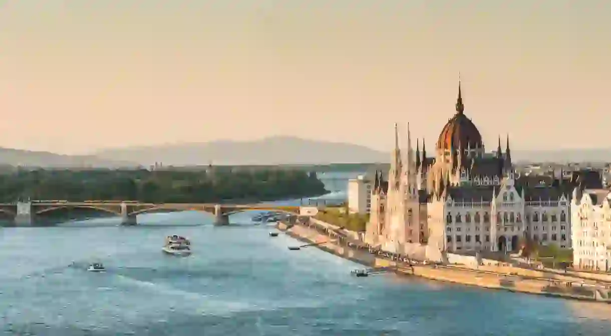 The Neo-Gothic Hungarian Parliament stands on the bank of the River Danube