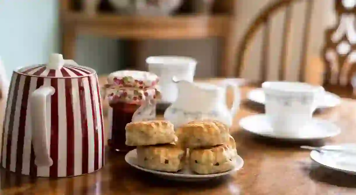 Traditional Devon cream tea with fruit scones and strawberry jam