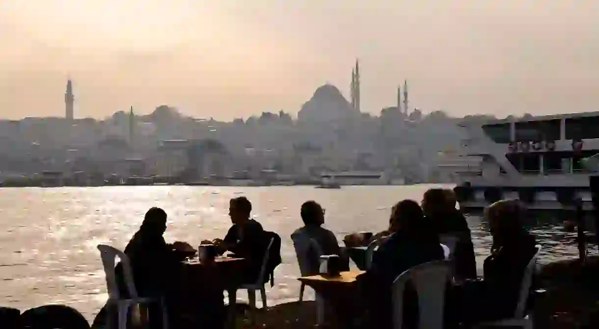 Diners at a fish restaurant next to the Karakoy Fish Market in Istanbul near the Galata Bridge