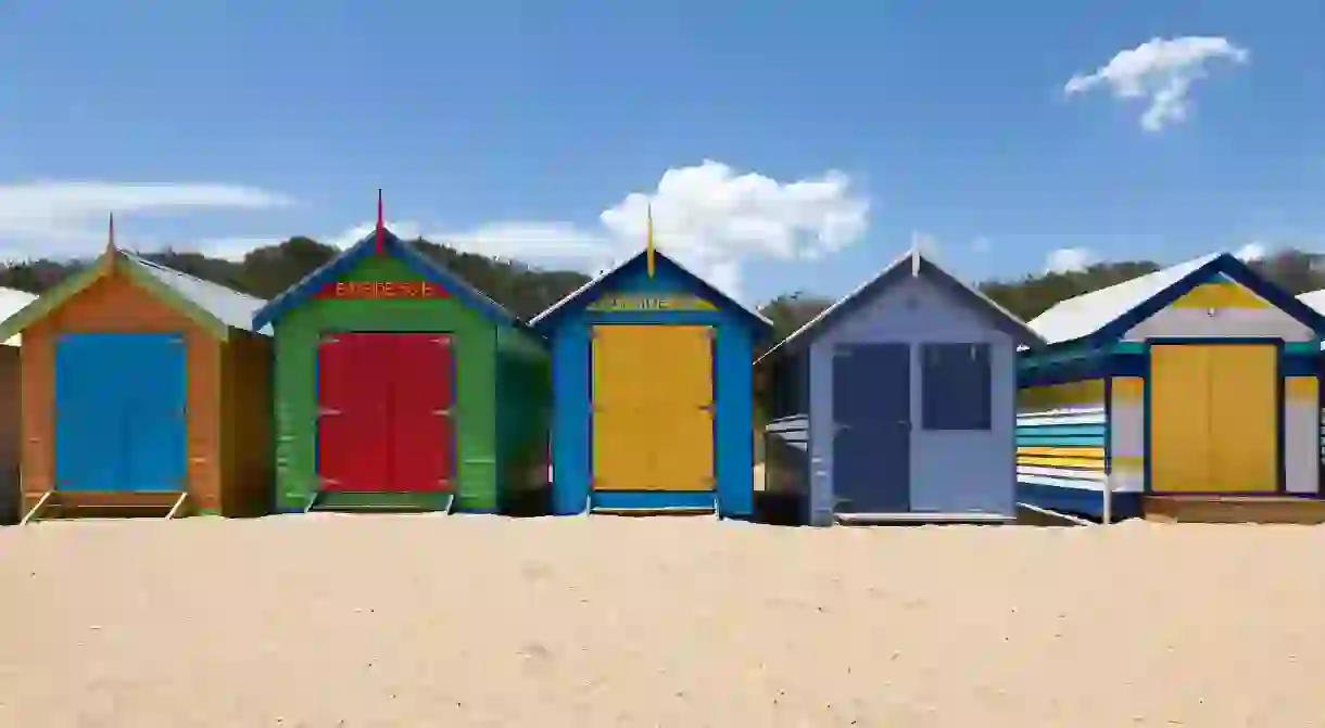 Painted beach huts adorn Brighton Beach