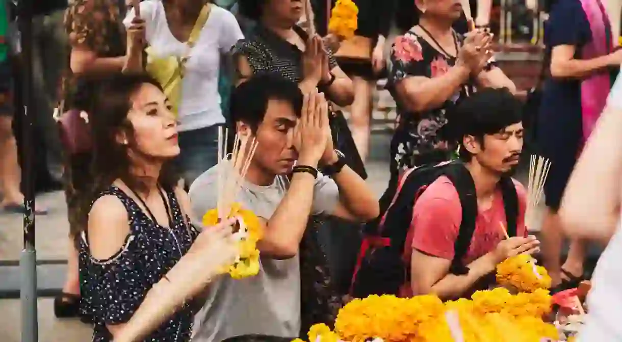 People pray at Bangkok’s shrines for many reasons