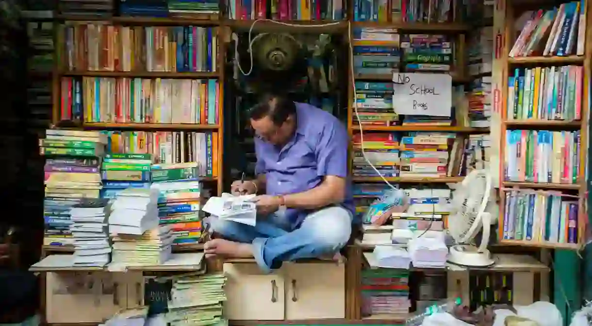 Indian book seller in the paper district of Delhi