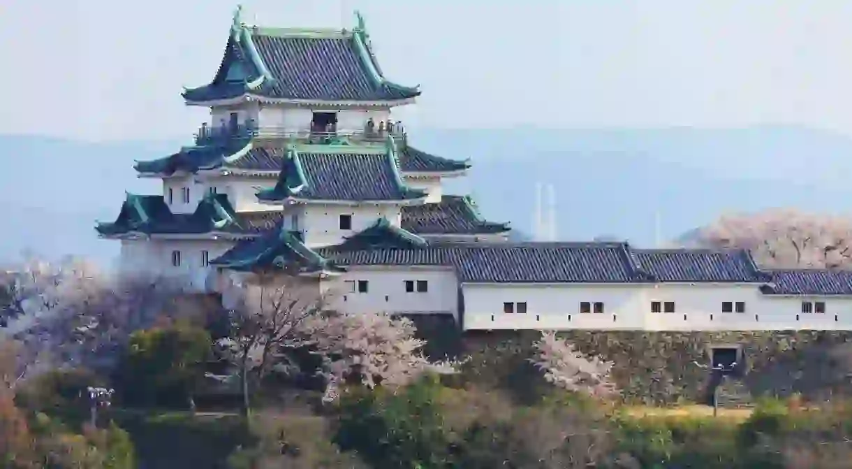 Wakayama Castle is perched atop a mountain overlooking the city