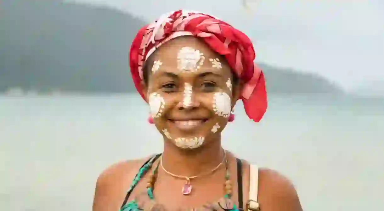 Portrait of a Malagasy woman with her face painted, Vezo-Sakalava tradition, Nosy Be, Madagascar.