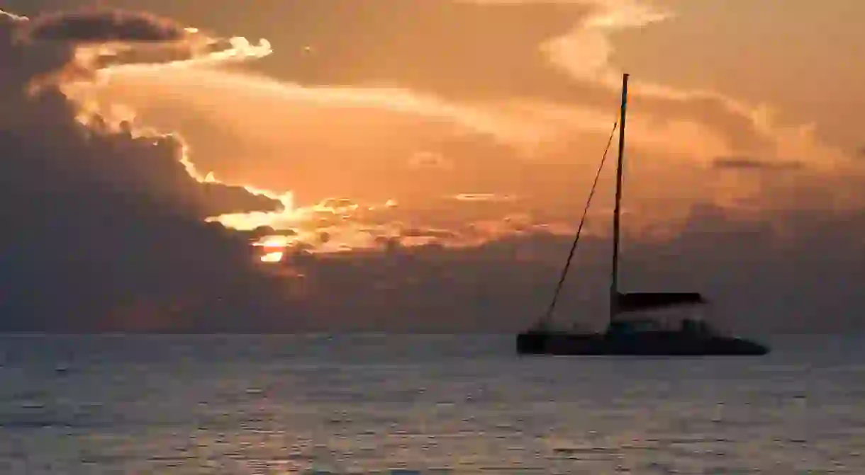 Watch the sun set on a relaxing catamaran cruise off Seven Mile Beach