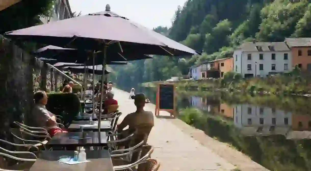 Tables outside the riverside cafe beside the River Our, Grand Duchy of Luxembourg