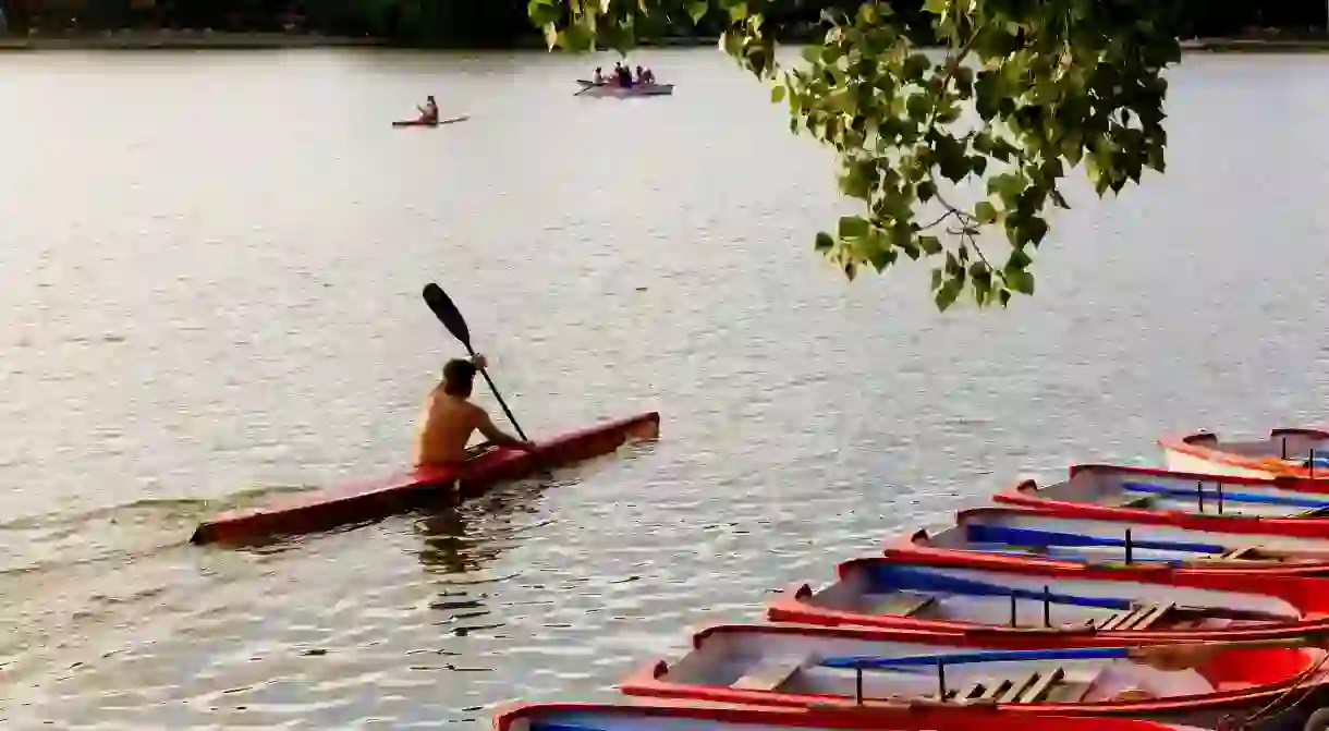 Kayaking on the lake in Casa de Campo park, Madrid