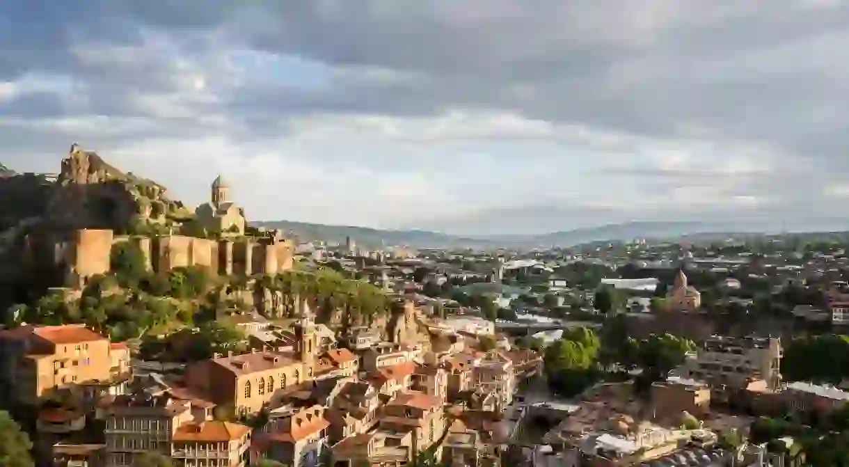 Get a birds eye view of Tbilisis diverse architecture from the Narikala fortress