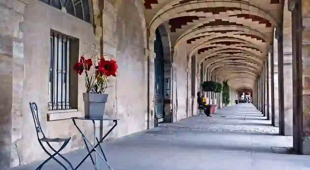 Arches of Des Vosges Square in Le Marais District, Paris