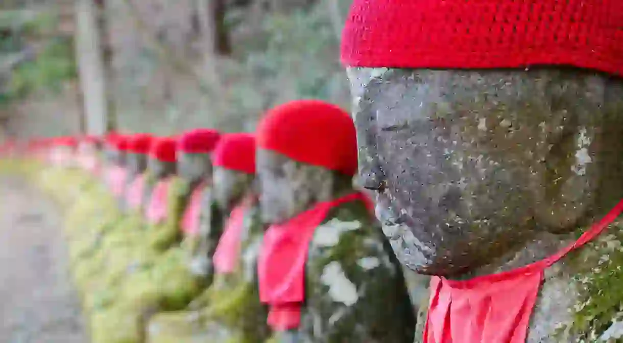 These statues are known as the Ghost Jizo because if you count them on the way up and again on the way back down, there will be a different number