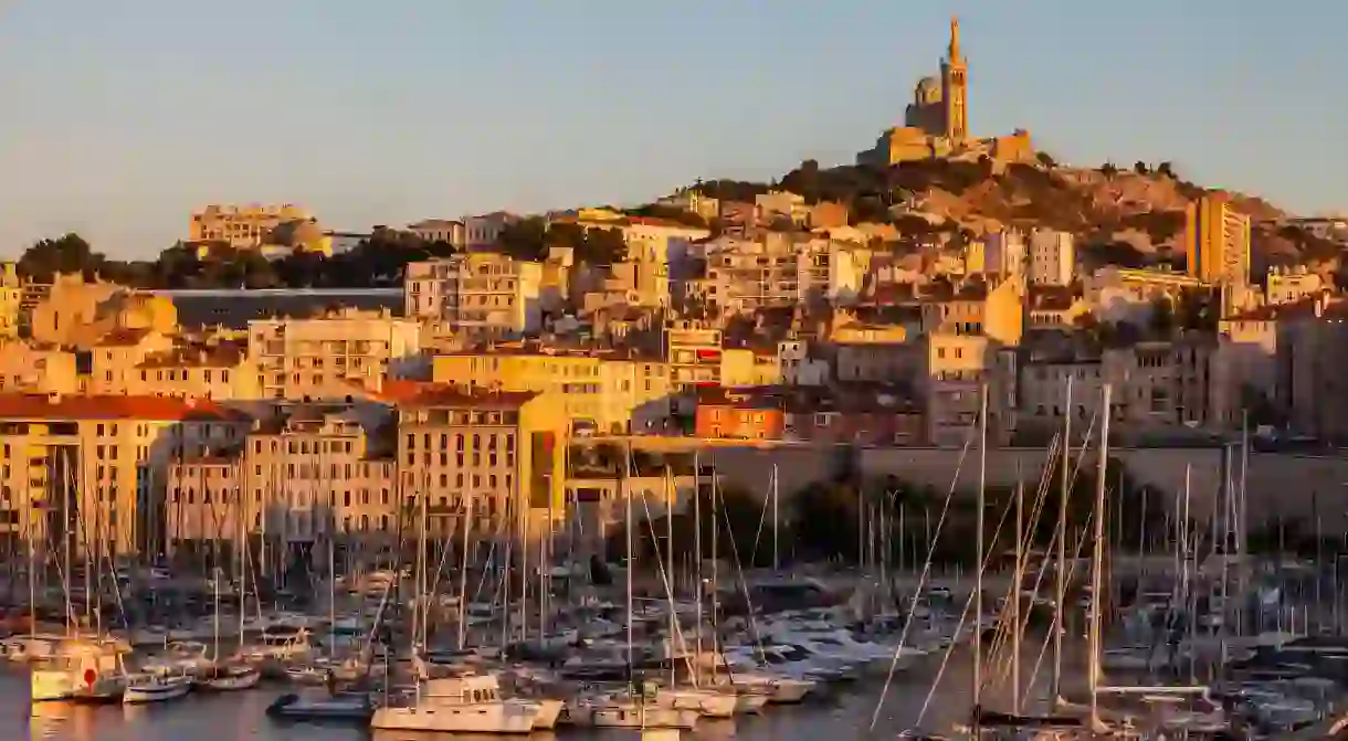 The glorious Basilique Notre-Dame de la Garde looks down over Marseilles iconic harbour