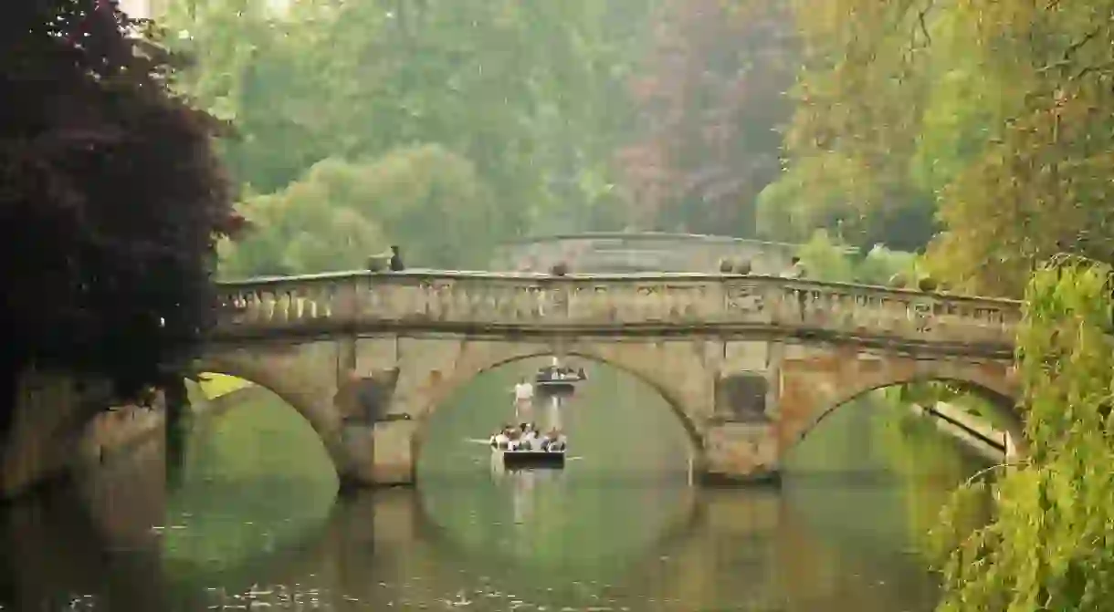 A punt passes under Clare College Bridge on the River Cam, Cambridge