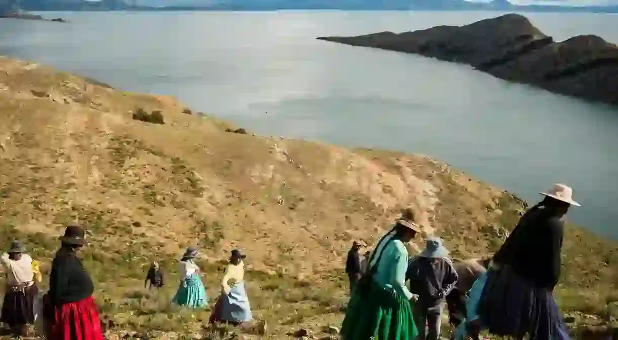 Local Bolivians work on repairing the Inca Trail on Isla del Sol