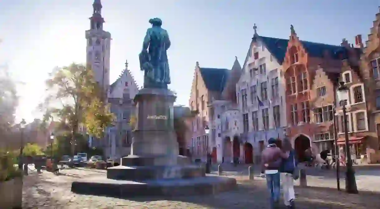 A statue of Jan van Eyck stands proudly in Bruges