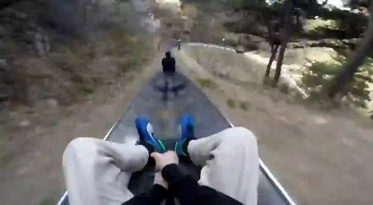 A toboggan run descends from the top of the Great Wall of China, covering 1.6km (1mi)