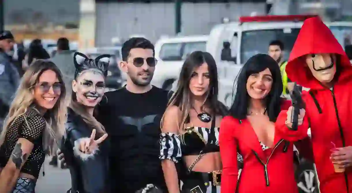 Revellers wear fancy dress for the Purim party in Tel Aviv, Israel