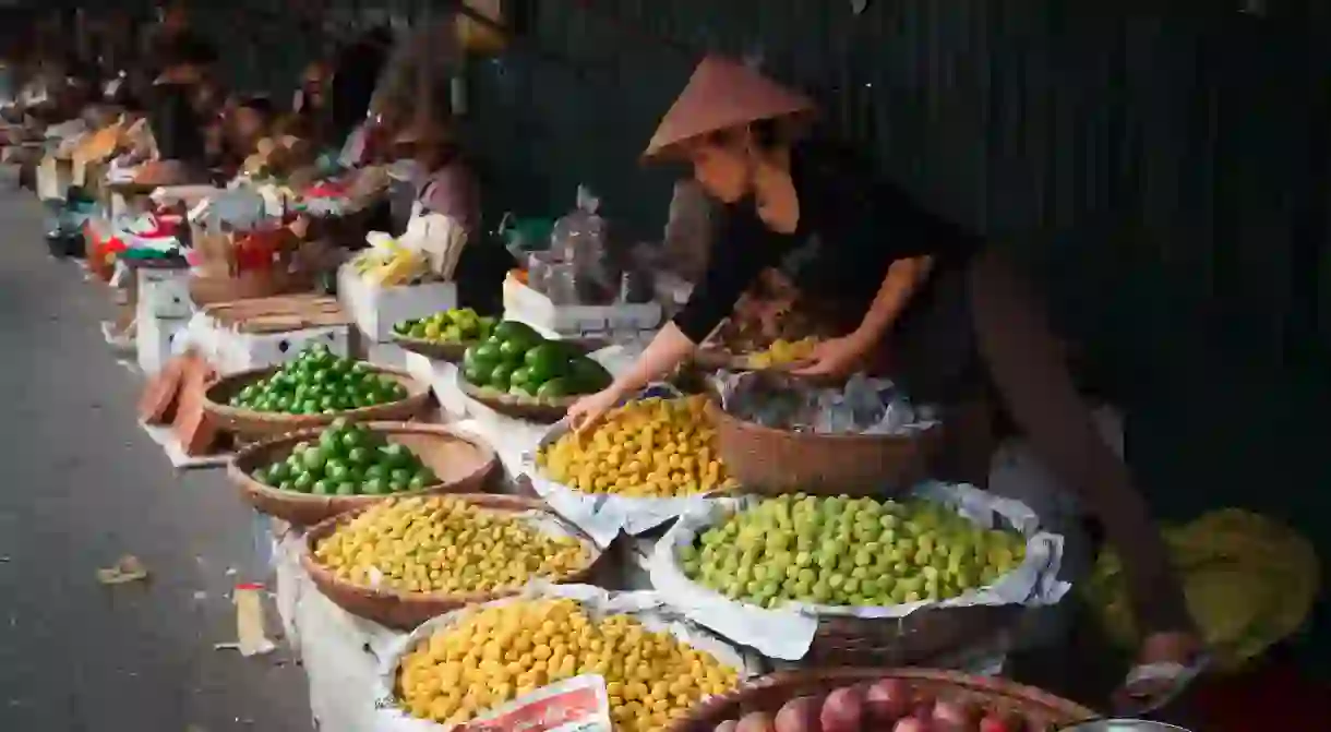 Head to a market in Hanoi to sample local food and get a sense of the city