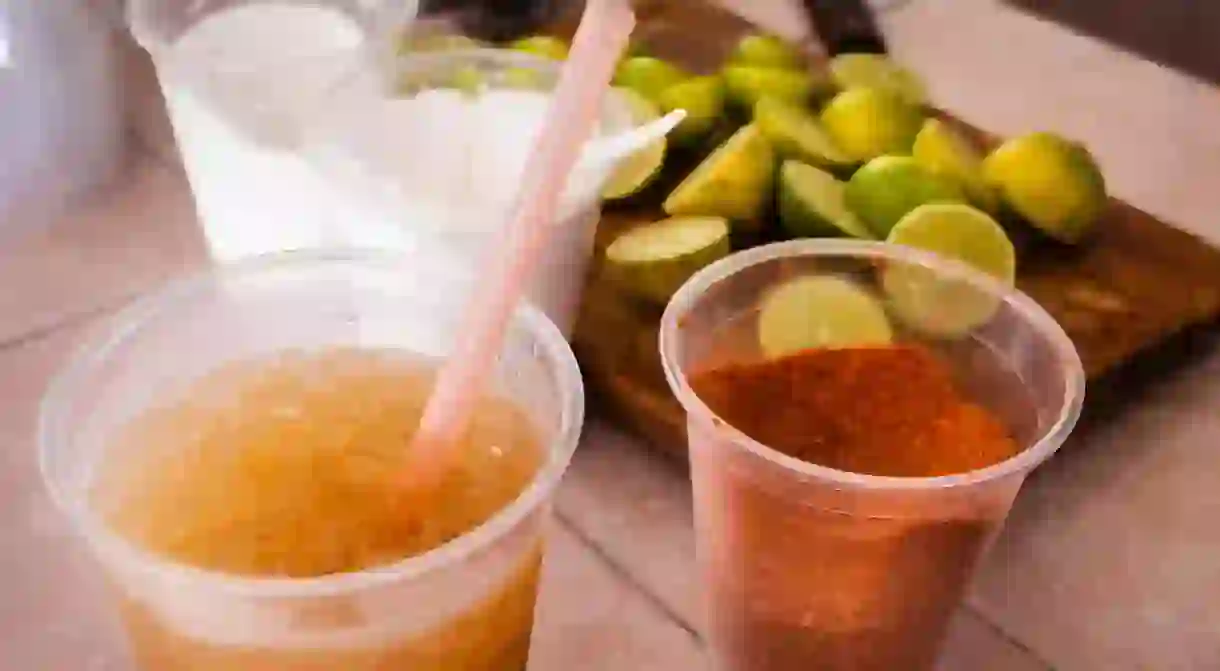 Salt, lime and chile are ready to be added to a glass of Tejuino, a refreshing corn based drink, in Mazatlan, Sinaloa, Mexico.